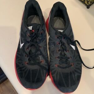 Men’s size 11 Nike Runners Black and Red. Good condition without insoles